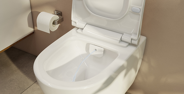 Close up of VitrA Aquacare combined toilet and bidet with water coming out